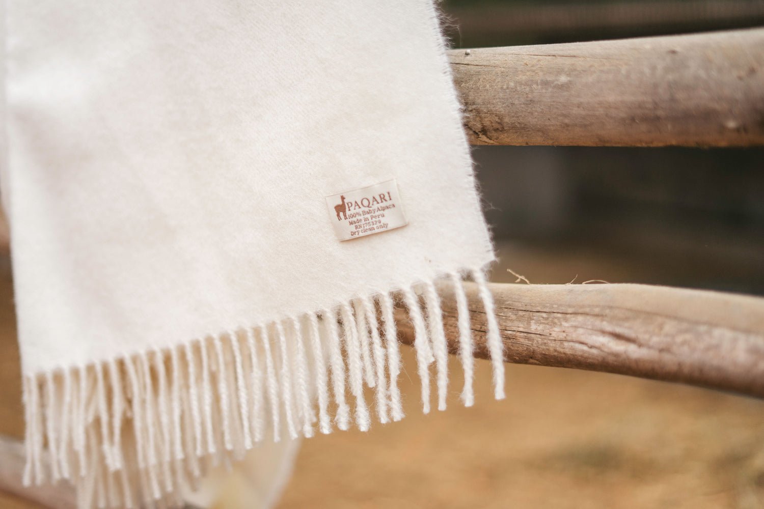 Hand-knotted fringe on a Natural baby alpaca throw
